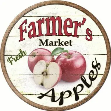 A SMART BLONDE Farmers Market Apples Novelty Metal Circular Sign C-604 with apples on it.