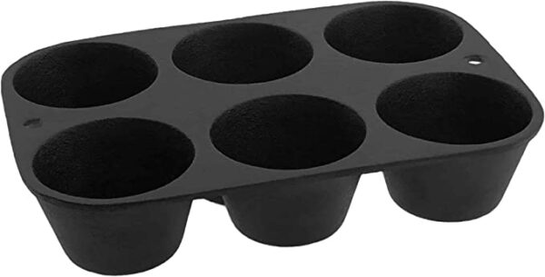 An Old Mountain 10122 Cast Iron Muffin Pan - 6 Impression with six muffins in it.