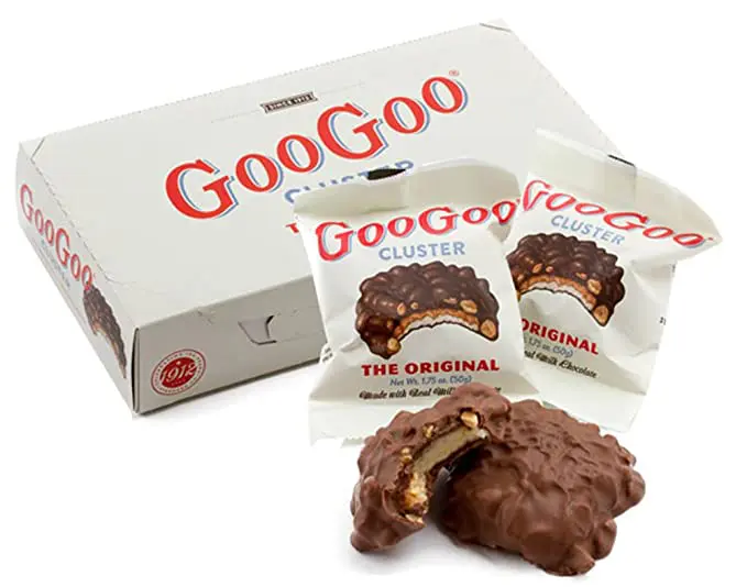 A box of GooGoo Clusters Original Candy Bar - 12 Count Case next to a box of chocolate.