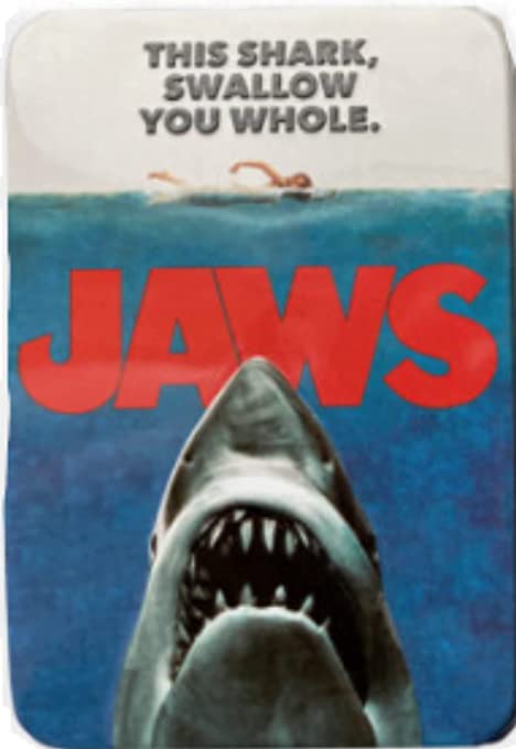 A Jaws Amity Island Candy - One (1) Collectible Jaws Movie Poster Tin- Shark Teeth Shape - Sour Cherry Flavor with the words Jaws on it.