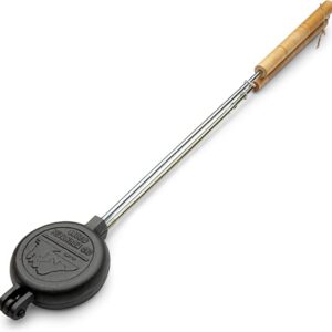 A Old Mountain Pre Seasoned Round Pie Iron, 28 Inch Long with a handle on a white background.