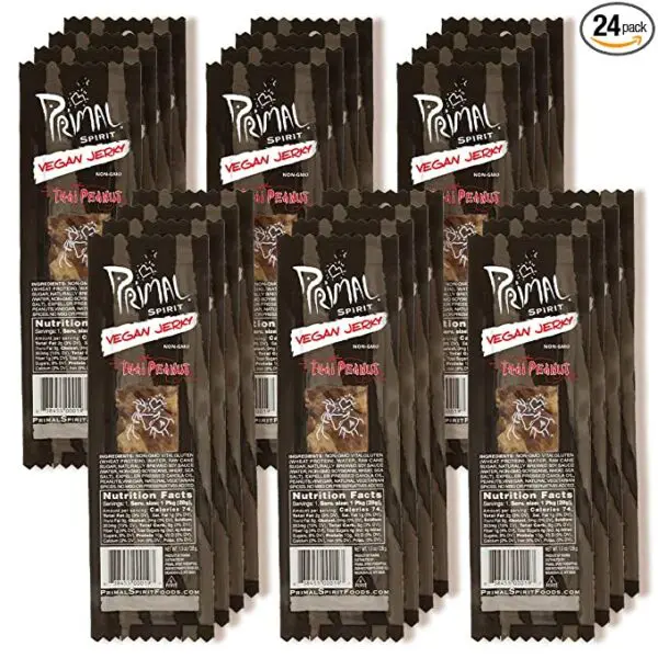 A pack of twenty-four Primal Spirit Vegan Jerky – “Classic Flavor” – Thai Peanut, 10 g. Plant Based Protein, Certified Non-GMO, No Preservatives, Sports Friendly Packaging on a white background.