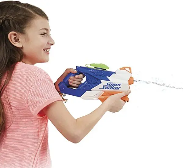 A girl is playing with a Nerf Super Soaker FreezeFire 2.0.