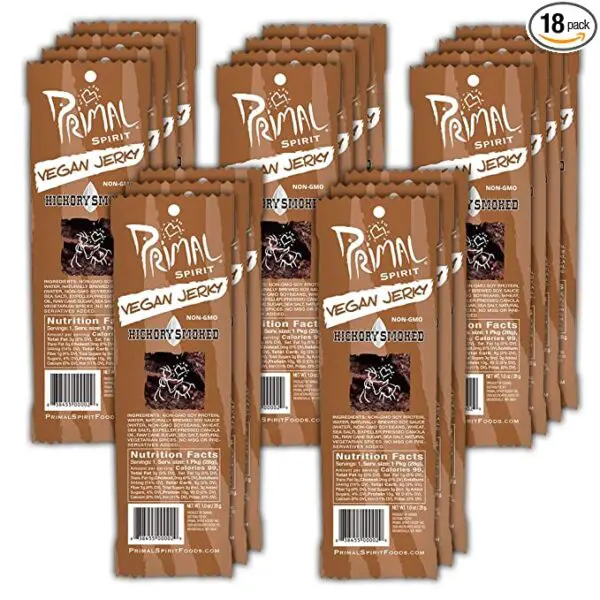 A pack of Primal Spirit Vegan Jerky – “Classic Flavor” – Hickory Smoked, 10 g. Plant Based Protein per oz., Certified Non-GMO, No Preservatives, Sports Friendly Packaging (18 Pack, 1 oz. ea.) on a white background.