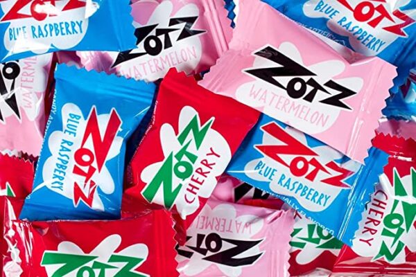 A pile of Zotz Fizz Power Candy Assorted - Fruit Flavored Hard Candy with a Fizzy Center | 230g Bag, Single Pack | Cherry, Watermelon & Blue Raspberry | Gluten-Free cherry candy.