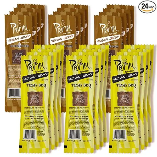 A pack of twenty-four Primal Spirit Vegan Jerky - Soy Protein Energy Packs, 10 g. Plant Based Protein, Certified Non-GMO, No Preservatives, Sports Friendly Packaging The Classics Hickory Smoked and Texas BBQ on a white background.