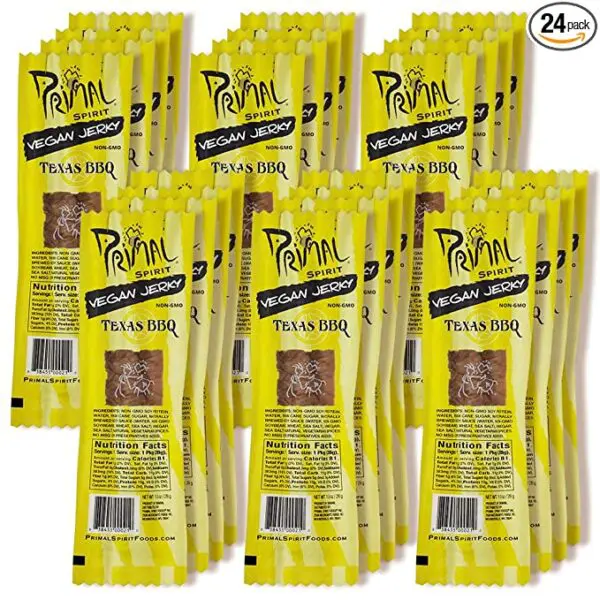 A pack of Primal Spirit Vegan Jerky – “Classic Flavor” – Texas BBQ, 10 g. Plant Based Protein, Certified Non-GMO, No Preservatives, Sports Friendly Packaging (24 Pack, 1 oz) on a white background.