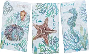 Three Kay Dee Designs Set of 3 Beachcomber Dual Purpose Terry Kitchen Towels with seahorses and seashells on them.