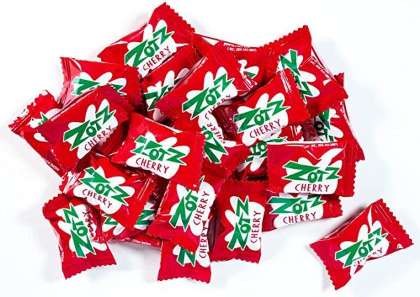 A pile of Zotz Fizz Power Candy Cherry - Fruit Flavored Hard Candy With a Fizzy Center | 230g Bag, Single Pack | Gluten-free on a white surface.