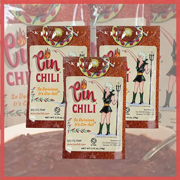 Three packs of Cin Chili Mix Deliciously Cin-ful Seasoning Sauce for Cooking or Baking on a plate.