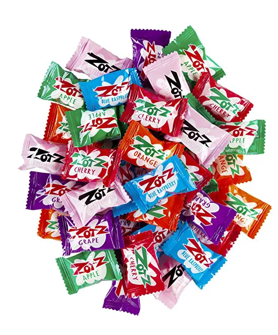 A pile of Zotz Fizz Power Candy Assorted - Fruit Flavored Hard Candy with a Fizzy Center | 5-Pound Bag, Single Pack | Gluten-Free on a white background.